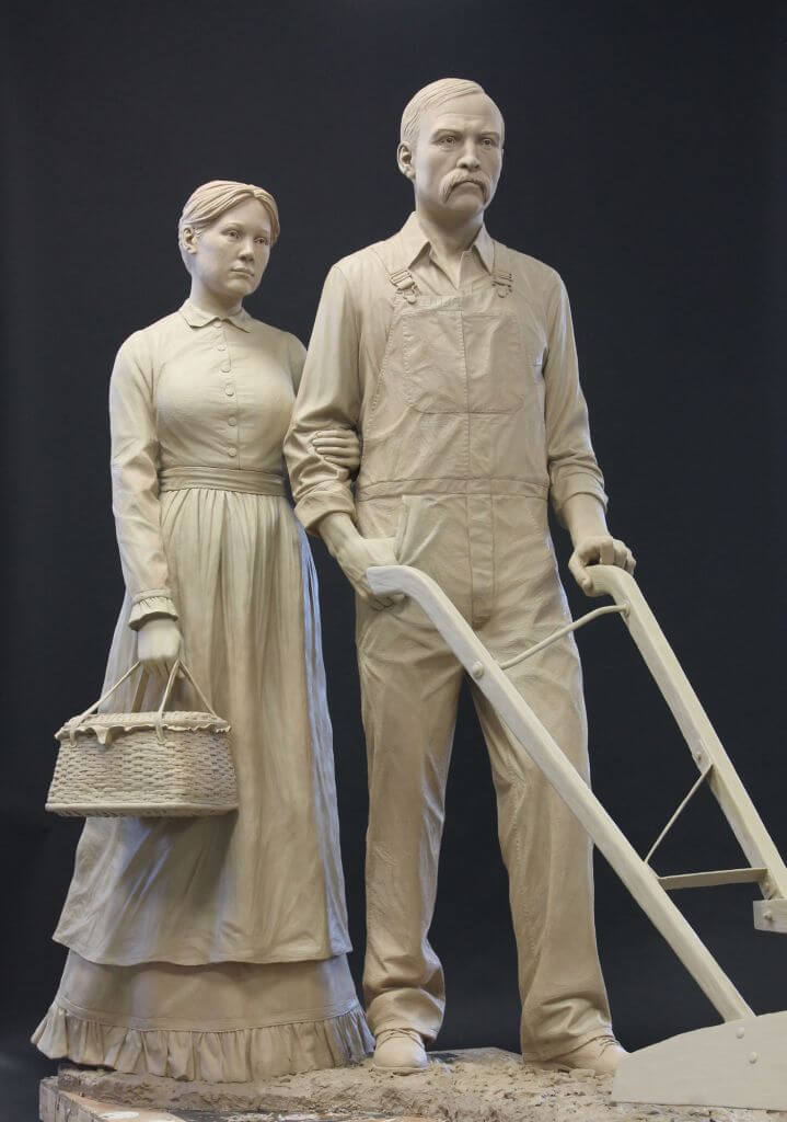 Picture of original clay sculpture of Farmer and Wife by Benjamin Victor.