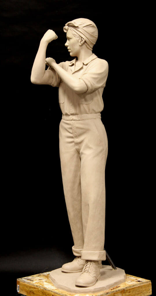 Bronze sculpture of Rosie The Riveter. Life size statue of Rosie The Riveter.