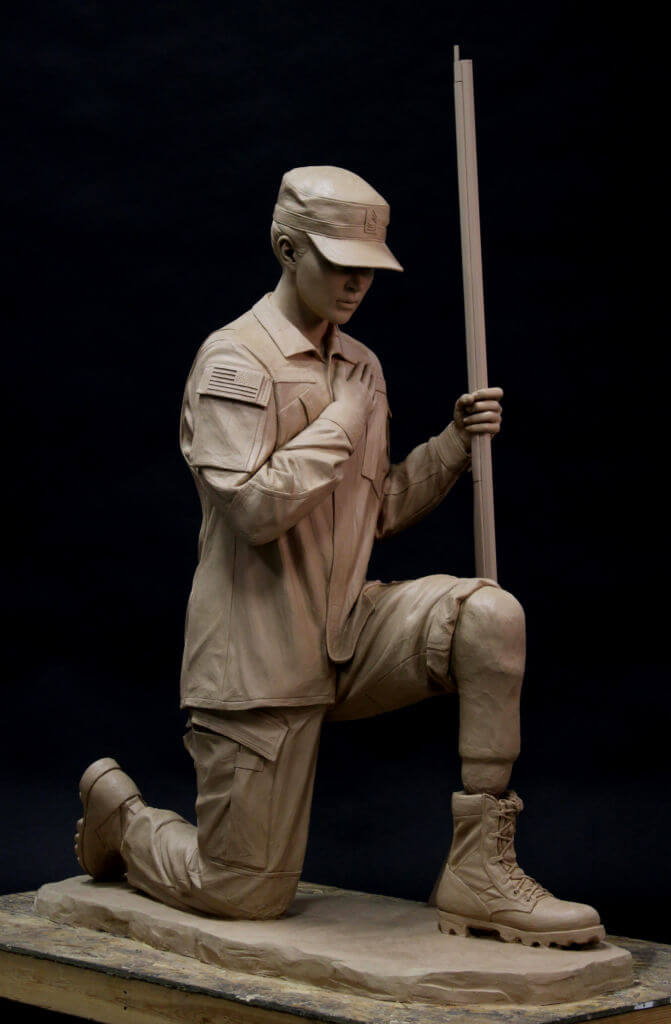 Bronze sculpture of a kneeling soldier. Military bronze sculpture.