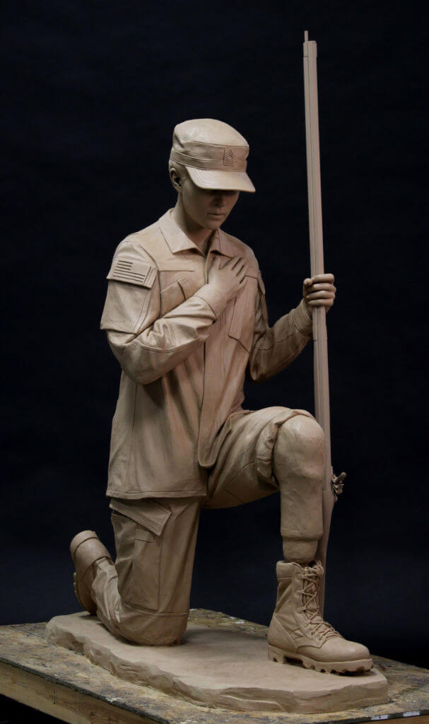 Bronze sculpture of a kneeling soldier. Military bronze sculpture.